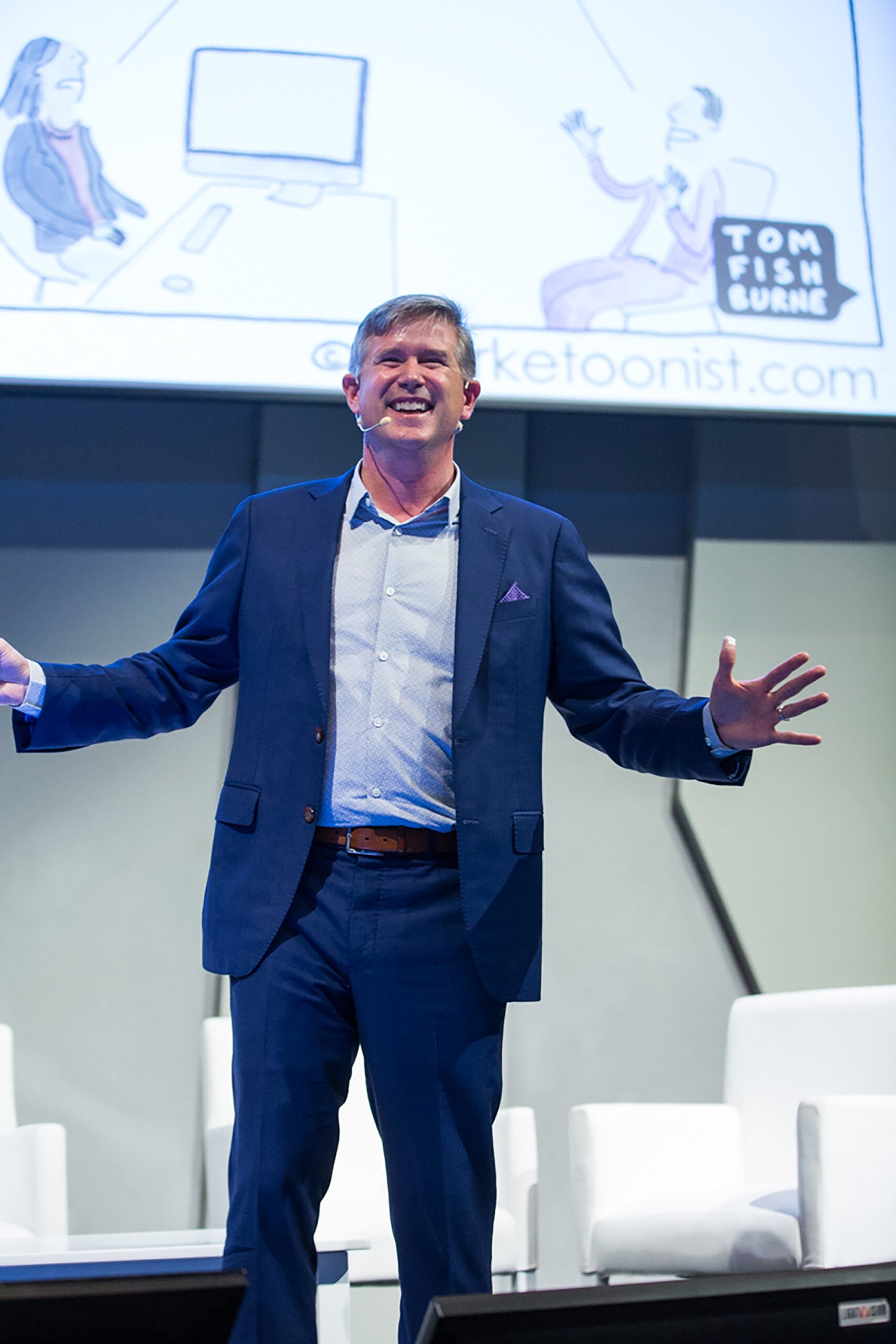Tom Fishburne delivering a keynote on stage