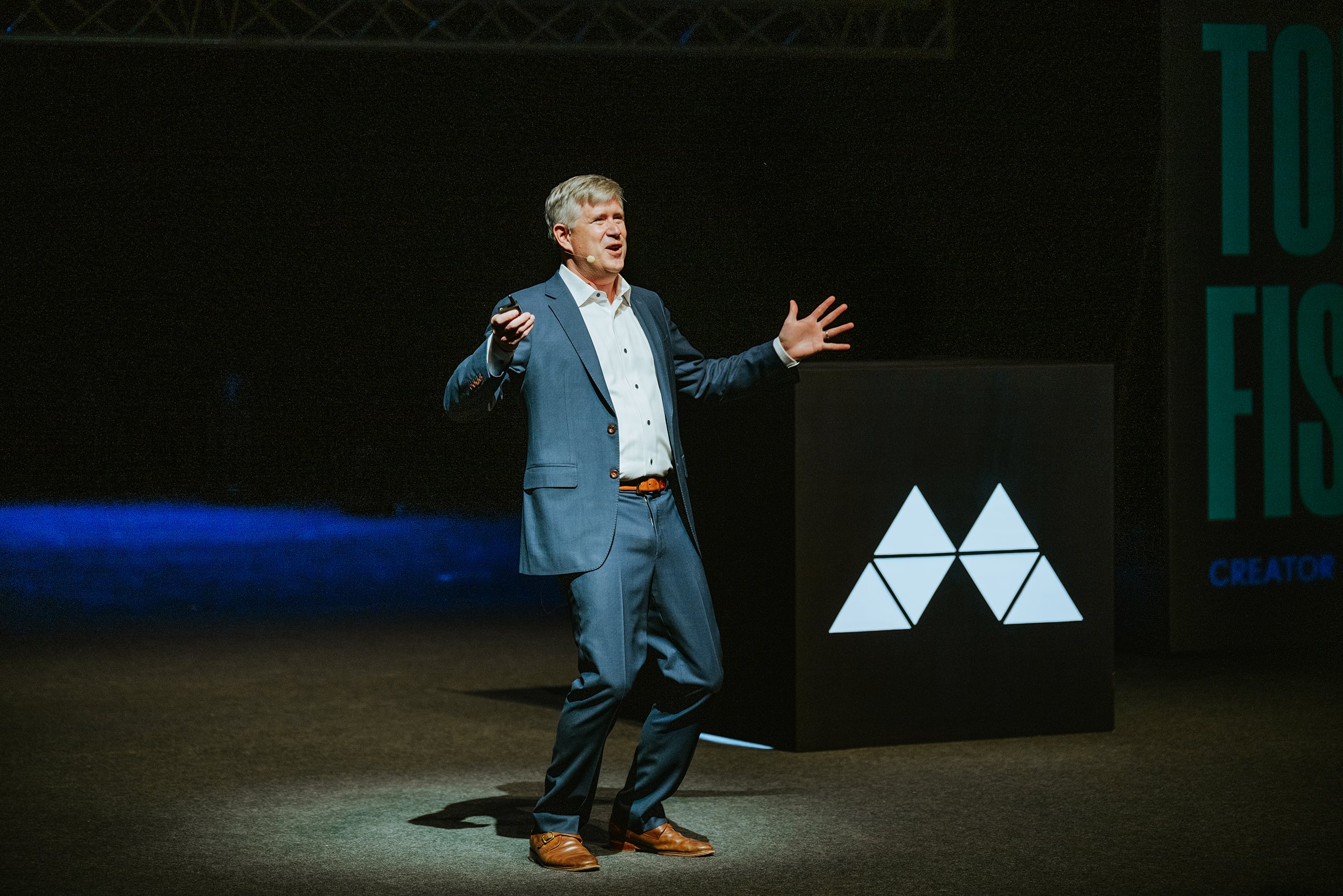 Tom Fishburne delivering a keynote on stage